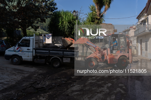 The residents of San Felice a Cancello, in the province of Caserta, deal with the aftermath of the mudslide and water that pour into the tow...