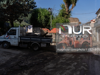 The residents of San Felice a Cancello, in the province of Caserta, deal with the aftermath of the mudslide and water that pour into the tow...