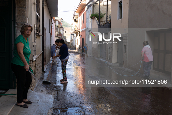 The residents of San Felice a Cancello, in the province of Caserta, deal with the aftermath of the mudslide and water that pour into the tow...