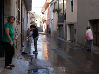 The residents of San Felice a Cancello, in the province of Caserta, deal with the aftermath of the mudslide and water that pour into the tow...