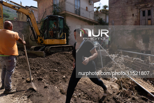 The residents of San Felice a Cancello, in the province of Caserta, deal with the aftermath of the mudslide and water that pour into the tow...