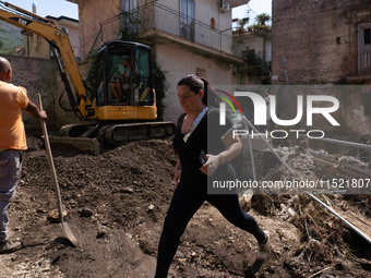 The residents of San Felice a Cancello, in the province of Caserta, deal with the aftermath of the mudslide and water that pour into the tow...