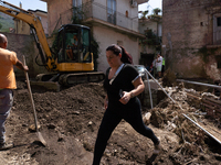 The residents of San Felice a Cancello, in the province of Caserta, deal with the aftermath of the mudslide and water that pour into the tow...