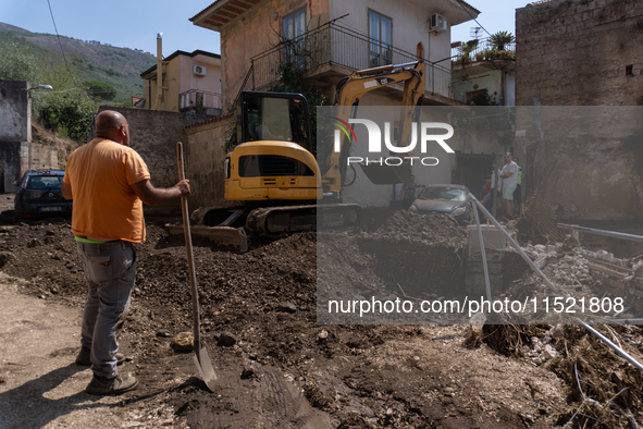 The residents of San Felice a Cancello, in the province of Caserta, deal with the aftermath of the mudslide and water that pour into the tow...