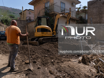 The residents of San Felice a Cancello, in the province of Caserta, deal with the aftermath of the mudslide and water that pour into the tow...