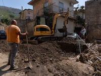 The residents of San Felice a Cancello, in the province of Caserta, deal with the aftermath of the mudslide and water that pour into the tow...