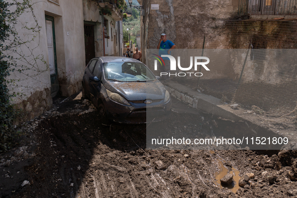 The residents of San Felice a Cancello, in the province of Caserta, deal with the aftermath of the mudslide and water that pour into the tow...