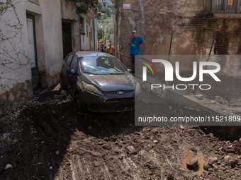 The residents of San Felice a Cancello, in the province of Caserta, deal with the aftermath of the mudslide and water that pour into the tow...