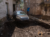 The residents of San Felice a Cancello, in the province of Caserta, deal with the aftermath of the mudslide and water that pour into the tow...