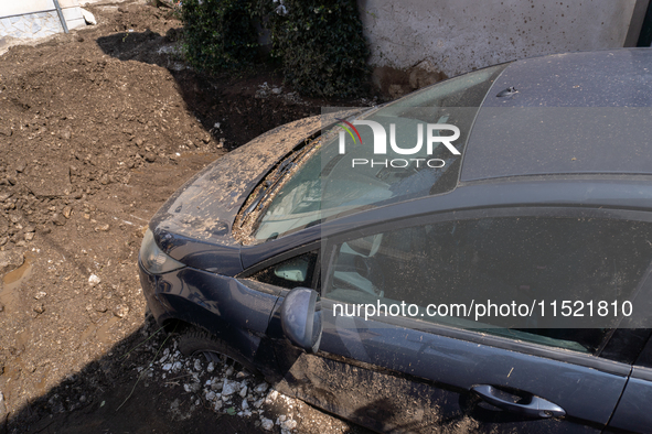 The residents of San Felice a Cancello, in the province of Caserta, deal with the aftermath of the mudslide and water that pour into the tow...