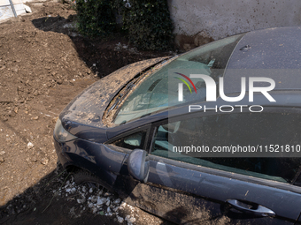 The residents of San Felice a Cancello, in the province of Caserta, deal with the aftermath of the mudslide and water that pour into the tow...