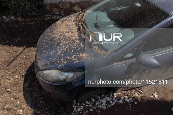 The residents of San Felice a Cancello, in the province of Caserta, deal with the aftermath of the mudslide and water that pour into the tow...