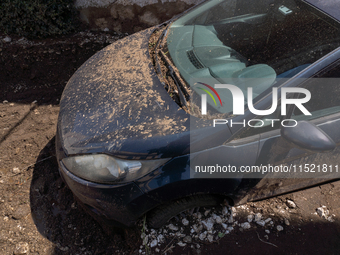 The residents of San Felice a Cancello, in the province of Caserta, deal with the aftermath of the mudslide and water that pour into the tow...