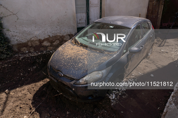 The residents of San Felice a Cancello, in the province of Caserta, deal with the aftermath of the mudslide and water that pour into the tow...