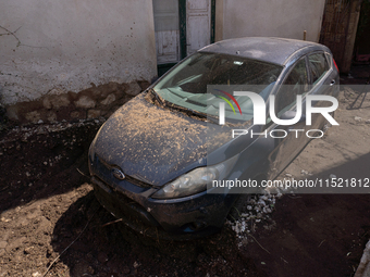 The residents of San Felice a Cancello, in the province of Caserta, deal with the aftermath of the mudslide and water that pour into the tow...