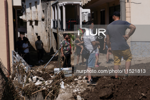 The residents of San Felice a Cancello, in the province of Caserta, deal with the aftermath of the mudslide and water that pour into the tow...