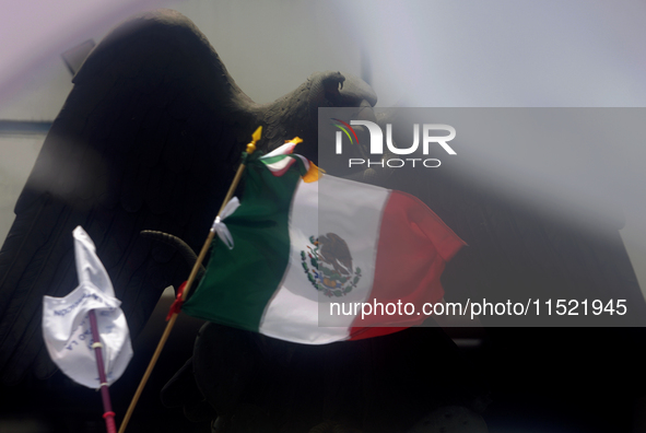 Students and workers of the Faculty of Law of the UNAM wave flags of Mexico in Ciudad Universitaria, Mexico, on August 28, 2024, to protest...