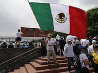 Students and workers of the Faculty of Law of the UNAM wave flags of Mexico in Ciudad Universitaria, Mexico, on August 28, 2024, to protest...