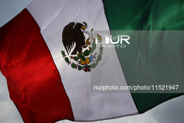 Students and workers of the Faculty of Law of the UNAM wave flags of Mexico in Ciudad Universitaria, Mexico, on August 28, 2024, to protest...