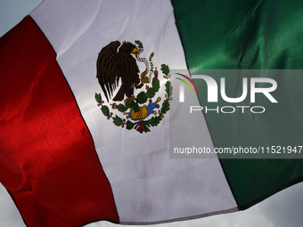 Students and workers of the Faculty of Law of the UNAM wave flags of Mexico in Ciudad Universitaria, Mexico, on August 28, 2024, to protest...