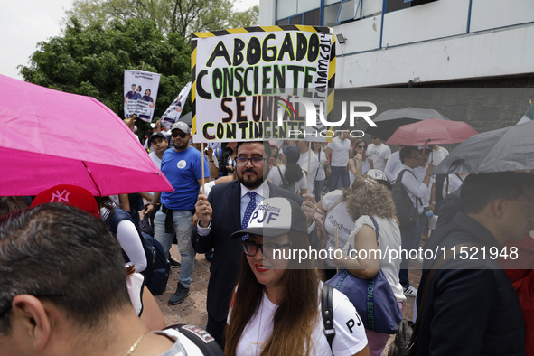 Students and workers of the Faculty of Law of the UNAM protest on August 28, 2024, at the University City facilities in Mexico City, Mexico,...