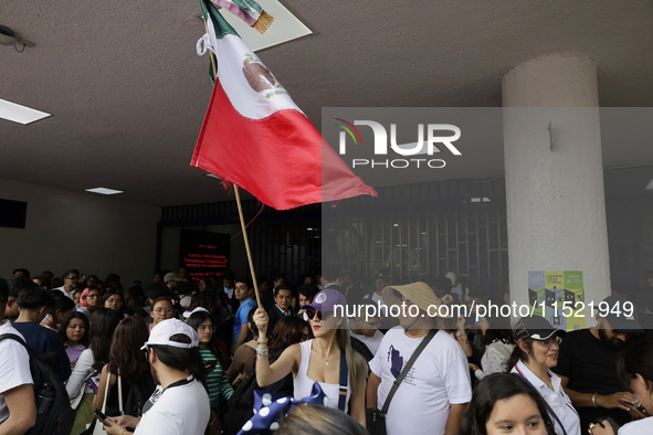 Students and workers of the Faculty of Law of the UNAM wave flags of Mexico in Ciudad Universitaria, Mexico, on August 28, 2024, to protest...