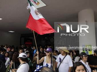 Students and workers of the Faculty of Law of the UNAM wave flags of Mexico in Ciudad Universitaria, Mexico, on August 28, 2024, to protest...