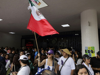 Students and workers of the Faculty of Law of the UNAM wave flags of Mexico in Ciudad Universitaria, Mexico, on August 28, 2024, to protest...