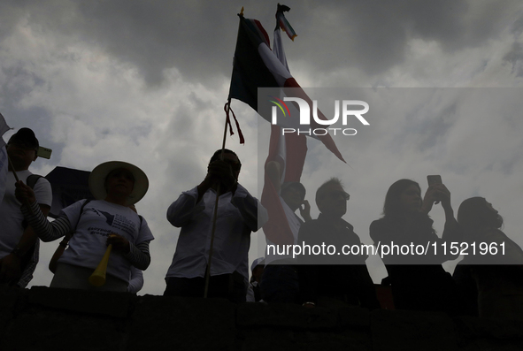 Students and workers of the Faculty of Law of the UNAM wave flags of Mexico in Ciudad Universitaria, Mexico, on August 28, 2024, to protest...