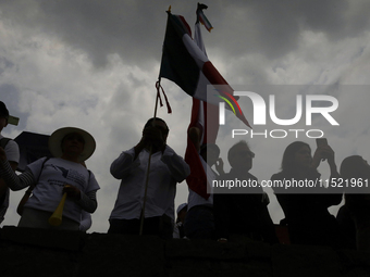 Students and workers of the Faculty of Law of the UNAM wave flags of Mexico in Ciudad Universitaria, Mexico, on August 28, 2024, to protest...