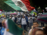 Students and workers of the Faculty of Law of the UNAM wave flags of Mexico in Ciudad Universitaria, Mexico, on August 28, 2024, to protest...