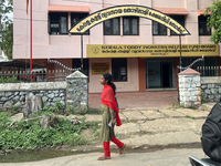 A woman walks past the Kerala Toddy Workers Welfare Fund Board building in Thiruvananthapuram (Trivandrum), Kerala, India, on April 16, 2024...