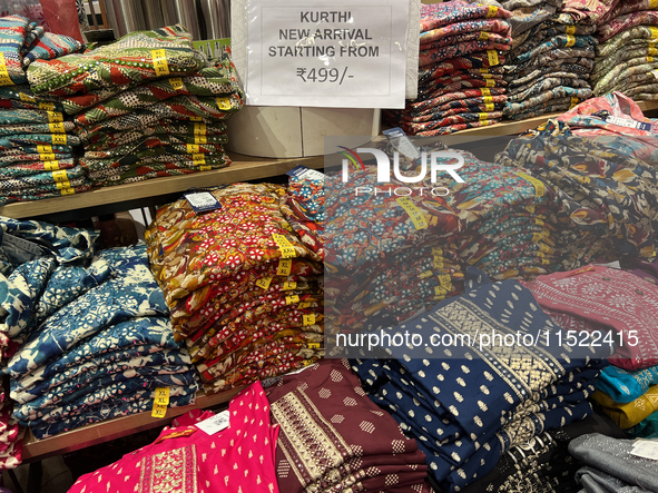 Kurtis are displayed at a discount textile shop in Thiruvananthapuram, Kerala, India, on April 16, 2024. 