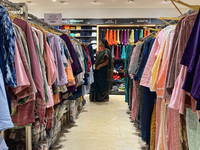 A woman shops for clothing at a textile shop in Thiruvananthapuram, Kerala, India, on April 16, 2024. (