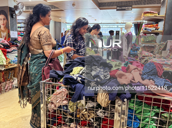 Women shop for clothing at a discount textile shop in Thiruvananthapuram, Kerala, India, on April 16, 2024. 