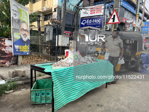 A man sells fish along the roadside in Thiruvananthapuram (Trivandrum), Kerala, India, on April 16, 2024. 