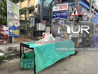 A man sells fish along the roadside in Thiruvananthapuram (Trivandrum), Kerala, India, on April 16, 2024. (