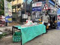 A man sells fish along the roadside in Thiruvananthapuram (Trivandrum), Kerala, India, on April 16, 2024. (