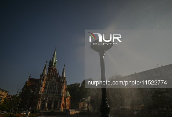 KRAKOW, POLAND - AUGUST 28:
A water sprinkler has been set up in Podgorze's Market Square for passers-by, as Southern Poland and Krakow face...