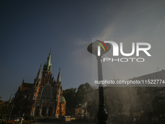 KRAKOW, POLAND - AUGUST 28:
A water sprinkler has been set up in Podgorze's Market Square for passers-by, as Southern Poland and Krakow face...