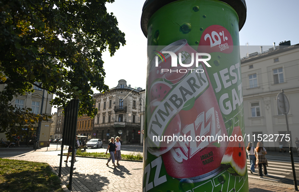 KRAKOW, POLAND - AUGUST 28:
An ad for Tymbark refreshment drink is displayed in Podgorze's Market Square as Southern Poland and Krakow face...