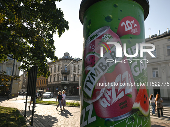 KRAKOW, POLAND - AUGUST 28:
An ad for Tymbark refreshment drink is displayed in Podgorze's Market Square as Southern Poland and Krakow face...