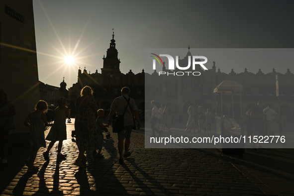 KRAKOW, POLAND - AUGUST 28:
A beautiful sunset and clear blue sky over Krakow's UNESCO Market Square, as Southern Poland and Krakow experien...