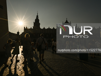 KRAKOW, POLAND - AUGUST 28:
A beautiful sunset and clear blue sky over Krakow's UNESCO Market Square, as Southern Poland and Krakow experien...