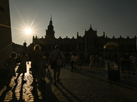 KRAKOW, POLAND - AUGUST 28:
A beautiful sunset and clear blue sky over Krakow's UNESCO Market Square, as Southern Poland and Krakow experien...