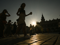 KRAKOW, POLAND - AUGUST 28:
A beautiful sunset and clear blue sky over Krakow's UNESCO Market Square, as Southern Poland and Krakow experien...