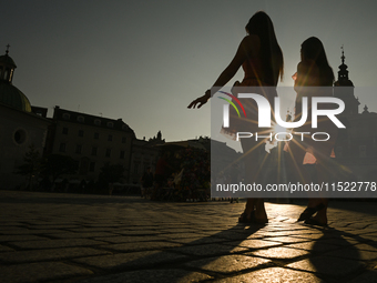 KRAKOW, POLAND - AUGUST 28:
A beautiful sunset and clear blue sky over Krakow's UNESCO Market Square, as Southern Poland and Krakow experien...