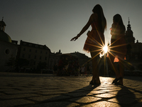 KRAKOW, POLAND - AUGUST 28:
A beautiful sunset and clear blue sky over Krakow's UNESCO Market Square, as Southern Poland and Krakow experien...