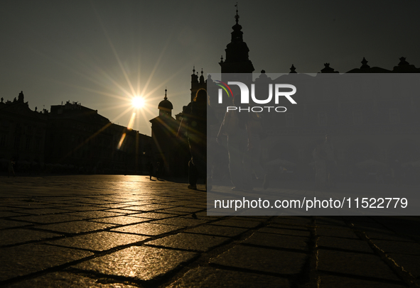 KRAKOW, POLAND - AUGUST 28:
A beautiful sunset and clear blue sky over Krakow's UNESCO Market Square, as Southern Poland and Krakow experien...