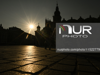 KRAKOW, POLAND - AUGUST 28:
A beautiful sunset and clear blue sky over Krakow's UNESCO Market Square, as Southern Poland and Krakow experien...